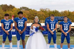 Post Photo by Kacy Kincaid Homecoming Queen Christa Warren with escorts Landon Groeneveld, Reggie Pearson, Jesse Lindeman, and Bryce Tankersley.